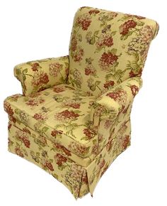 an upholstered chair with flowered fabric on the arms and back, sitting in front of a white background