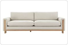 a white couch sitting on top of a wooden frame