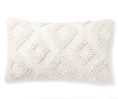 a white knitted pillow on a white background