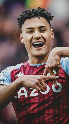 a close up of a soccer player with his mouth open