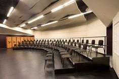 an empty room with rows of chairs in it