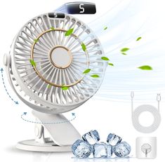 an electric fan sitting on top of a table next to ice cubes