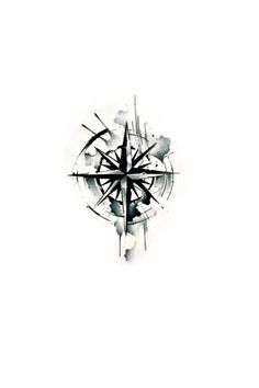 a black and white compass tattoo on the side of a wall with watercolor splashes