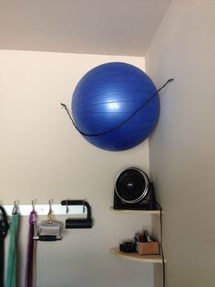 there is a blue ball hanging from the wall