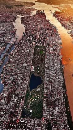 an aerial view of a city with lots of water and land in the foreground