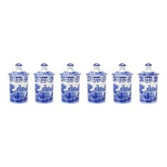 blue and white canisters are lined up in a row on a white background