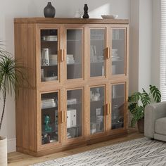 a wooden cabinet with glass doors in a living room