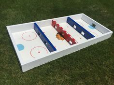 an inflatable ice hockey game set up on the grass