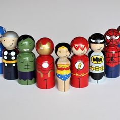 a group of wooden toy figurines sitting next to each other