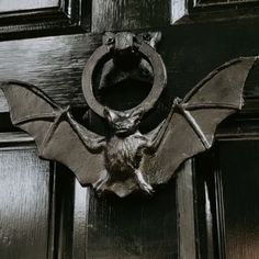 a bat hanging on the front door of a house