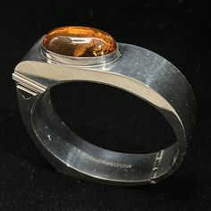 Tomasz Jagiello-Piwoszczuk Sterling Silver Amber Bracelet Poland Modernist Click the link to purchase💰⬇️ #brutalist #bracelet #cuff #modernist #jewelry #vintage #affiliate #ad Designer Oval Hallmarked Jewelry, Luxury Amber Jewelry For Formal Occasions, Modernist Oval Jewelry For Formal Occasions, Luxury Oval Bangle With Polished Finish, Designer Polished Finish Cuff Bracelet As Gift, Designer Handmade Sterling Silver Jewelry, Designer Polished Cuff Bracelet As Gift, Round Cuff Bracelet With Polished Finish For Formal Occasions, Formal Round Cuff Bracelet With Polished Finish