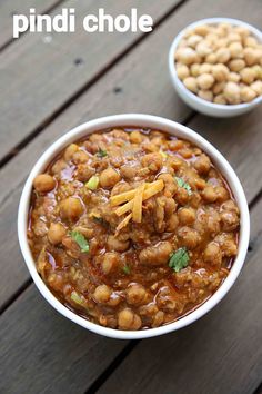 two bowls filled with chickpeas on top of a wooden table