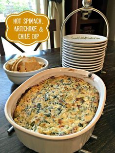 a casserole dish with spinach and artichoke dip