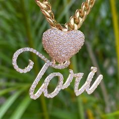 Indulge in the ultimate personalized luxury with our Custom Heart & Cursive Name Pendant. Embellished with diamonds, this pendant features your custom name in bold cursive font, paired with a stunning diamond filled puff heart as the bail. Choose from 10k or 14k gold to your preference. Metal: Available in 10k or 14k Gold Stone: Available in Natural SI Quality Diamonds Diamond Weight: 2.45ctw (Tori) Heart Height: 0.5" Name Height: 0.75" Production Time: 2-3 Weeks Made to order: select your metal Heart Cursive, Bold Cursive Font, West Indian Bangles, Picture Pendant, Name Pendant, Cursive Font, Cursive Fonts, Puffed Heart, Name Jewelry