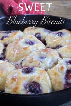 blueberry biscuits in a cast iron skillet with text overlay that reads, sweet blueberry biscuits