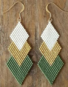 the earrings are made out of seed beads and have green, yellow and white squares on them