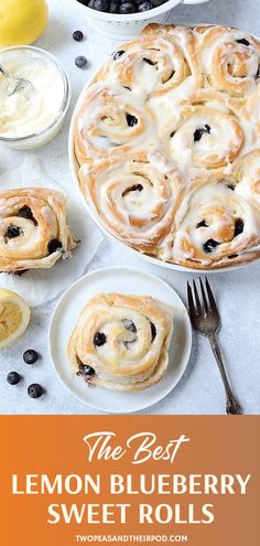 the best lemon blueberry sweet rolls on a white table with fresh fruit and whipped cream