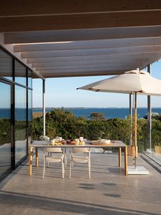 an outdoor dining area overlooking the ocean