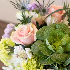 a bouquet of flowers sitting on top of a table