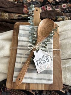 a wooden spoon sitting on top of a cutting board next to a tag that says, best time home