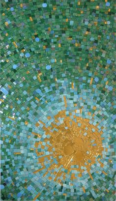 an abstract mosaic design made up of green and yellow squares with a gold sun in the center