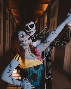 a woman dressed as jack skellingy and a man in skeleton makeup