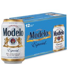 two cans of modelo beer next to each other on a white background with blue box