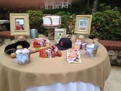 a table topped with pictures and baseball memorabilia