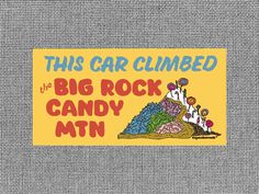 this car climbed the big rock candy mtn sticker on a gray fabric background