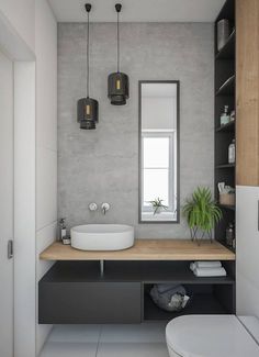 a bathroom with a sink, mirror and toilet in it's corner area next to a window