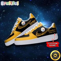 a pair of yellow and black sneakers with the pittsburgh football team logo on them in space