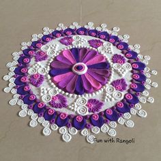 a purple and white doily with flowers on it