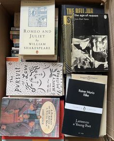 a box filled with lots of different books