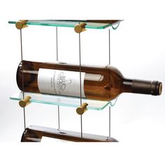 two wine bottles are hanging from glass shelves