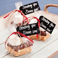 some cookies are wrapped in cellophane and tied with red ribbon