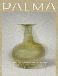 a green vase sitting on top of a white table next to a book with the words palma written in it