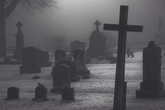 a black and white photo with the words ghost hunts in front of tombstones on a foggy day