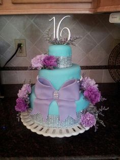 a blue and purple cake sitting on top of a counter