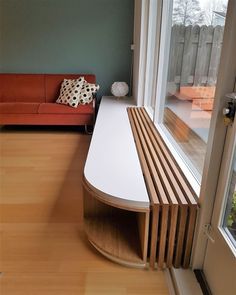 a living room filled with furniture next to a window