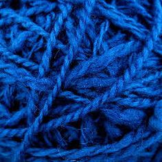 blue yarn is shown in this close up photo