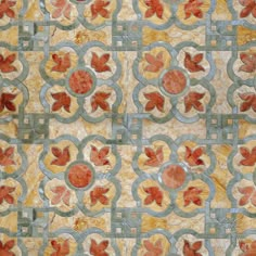 an artistic tile design with leaves and circles