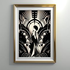 a black and white art piece hanging on the wall next to a framed photograph with gold trim