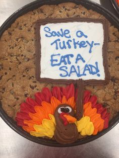 a cake decorated like a turkey with the words save a turkey eat a salad