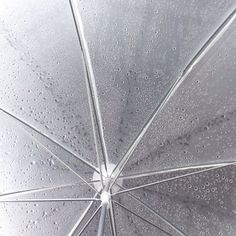 an umbrella with water drops on it