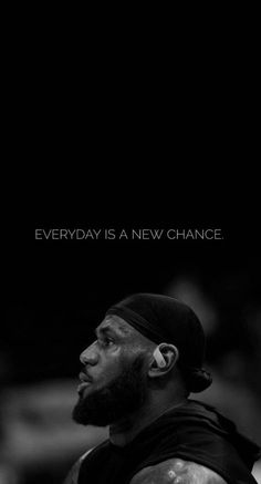 a black and white photo of a basketball player with the words everyday is a new chance