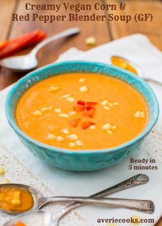 a bowl of creamy vegan corn and red pepper blend soup