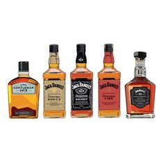 four bottles of jack daniels are lined up in a row on a white background,