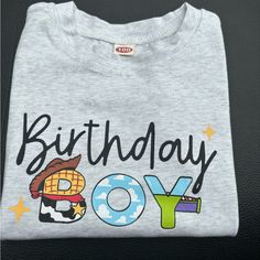 a gray birthday shirt with the words boy and an image of a cowboy on it