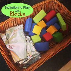 a basket filled with lots of different colored blocks