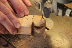 a person using a planer to cut wood